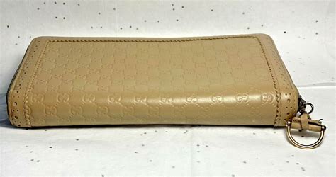 gucci zipper wallet beige|Gucci guccissima wallet.